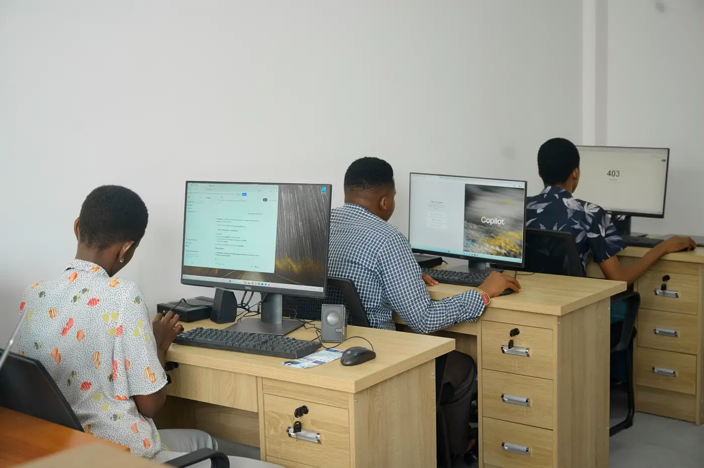 Professionals working through a hands-on computer training session at VIVA